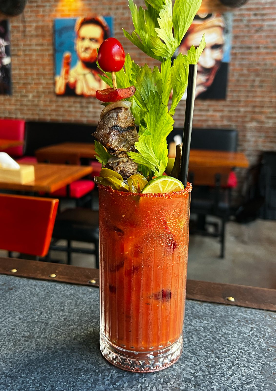 The Bloody Bull on the bar, with the brick walls and red booths behind